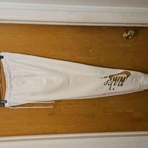 Nike Womens medium white joggers with Silver and Gold Logo